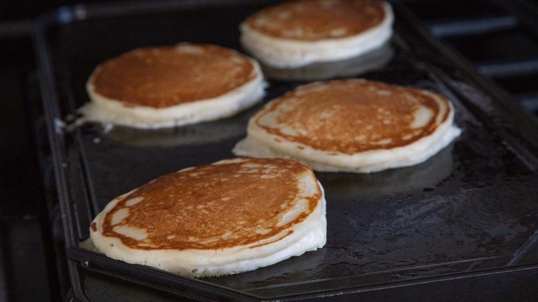 Cooked pancakes on griddle