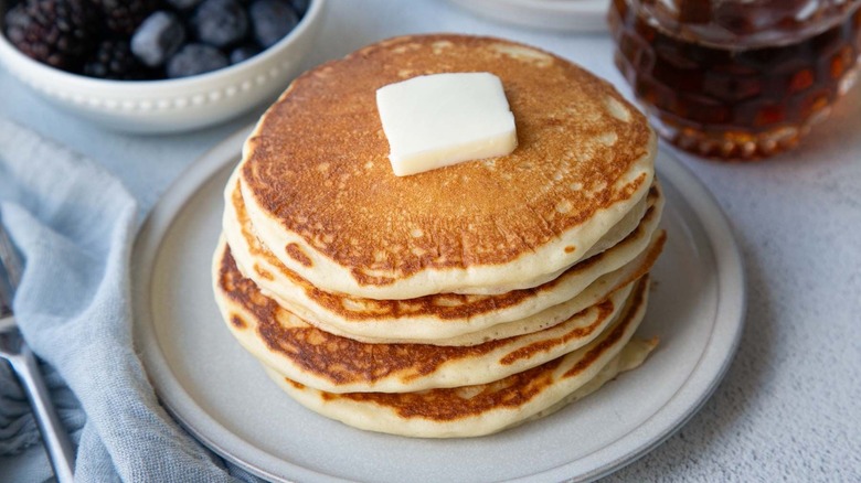 Stack of pancakes with pat of butter