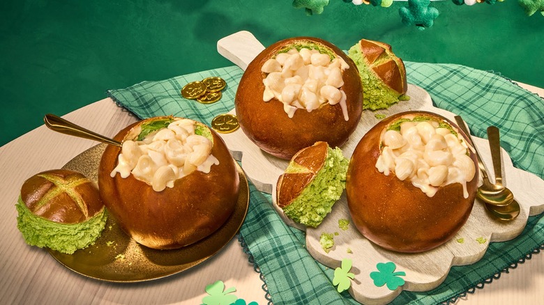 Green colored Panera Pot of Gold bread bowls with mac and cheese and gold coins