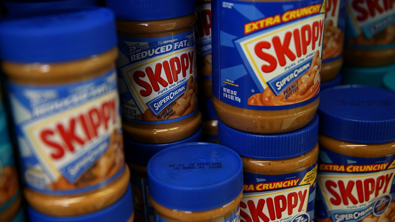 Jars of Skippy peanut butter on shelf