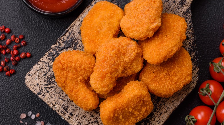 chicken nuggets on cutting board