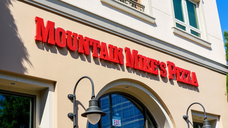 Storefront with Mountain Mike's Pizza sign