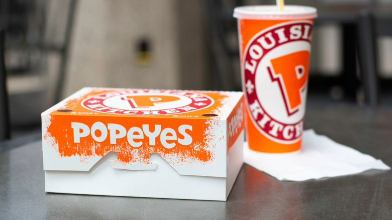 Meal box and fountain drink packaging from Popeyes restaurant