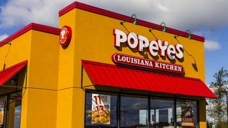 Popeyes orange store exterior with red awning