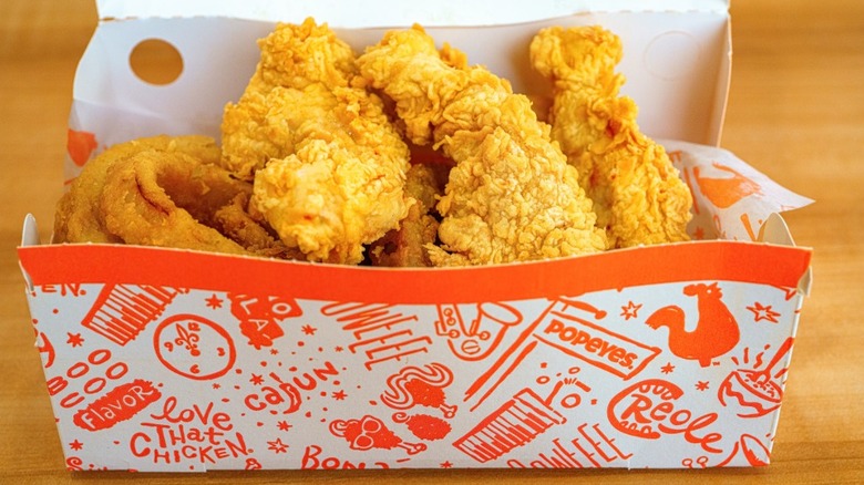 Popeyes chicken tenders in a to-go container