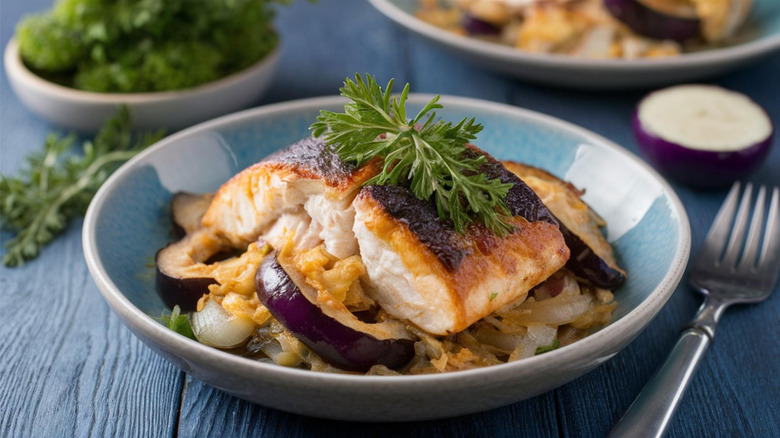 Baked cod on top of eggplant