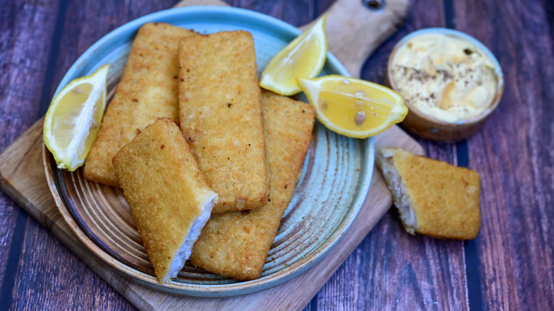 Pollock fried fish fillets on plate