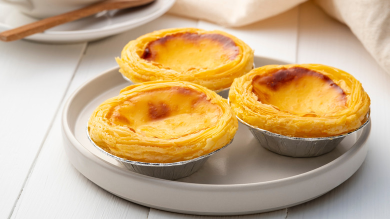 Pastel de nata (Portuguese egg tarts) served on a plate.