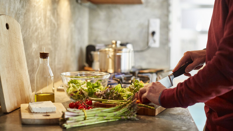 cutting and prepping vegetables for a meal