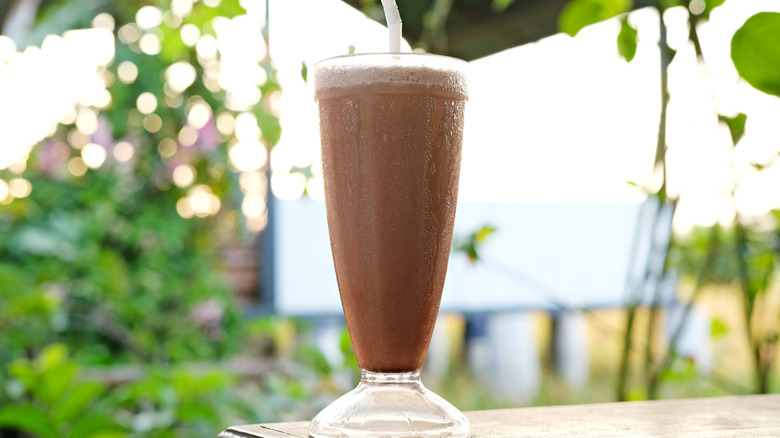 A chocolate milkshake in a glass