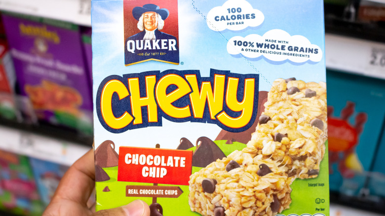 Handheld box of Quaker chewy granola bars