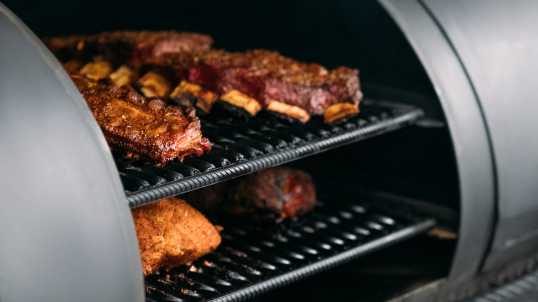 meats in a smoker