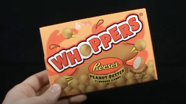 hand holding Reese's Whoppers