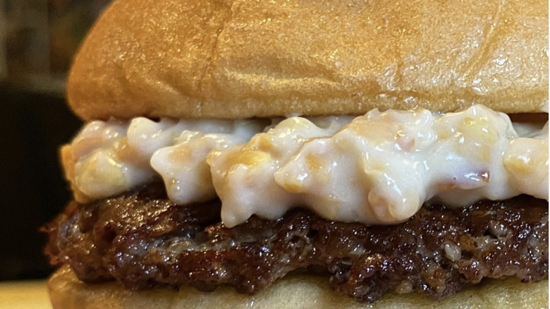 Burger topped with Miracle Whip and peanut sauce