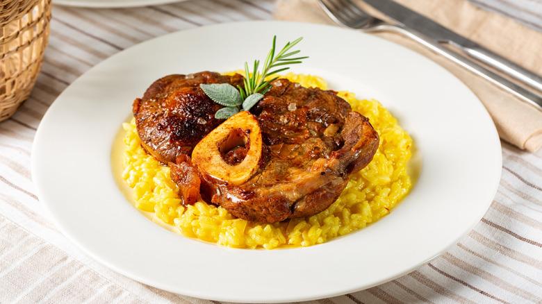 Plate of Risotto alla Milanese with osso buco