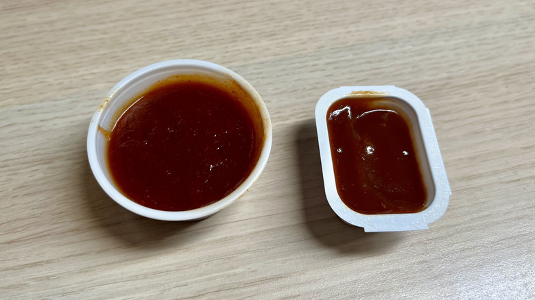 two cups pf BBQ sauces