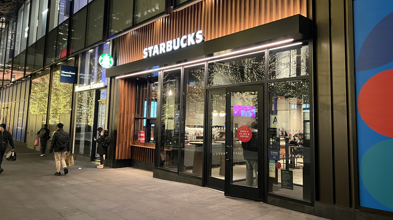 Exterior view of a Starbucks at night