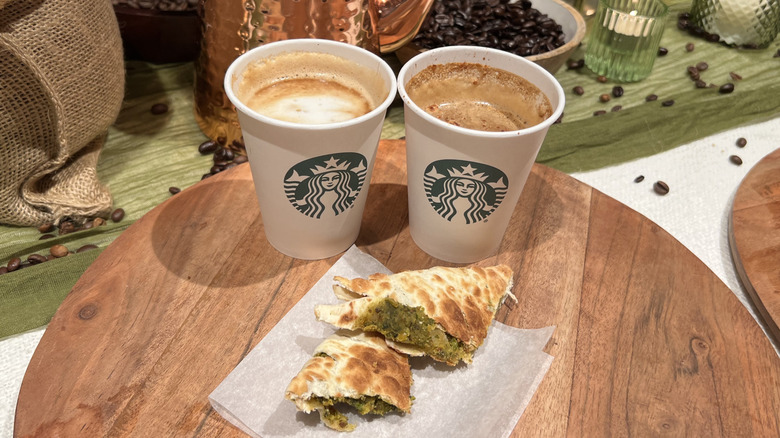 Starbucks' Cortado and Brown Sugar Cortado sit behind the Spicy Falafel Pocket