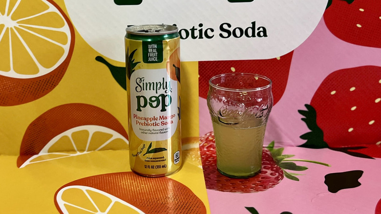 Simply Pop Pineapple Mango can and glass