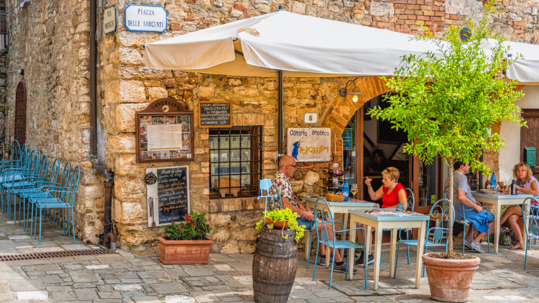 People sitting at outdoor Italian osteria