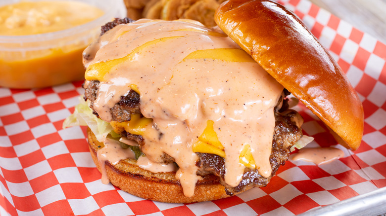 creamy orange sauce on burger