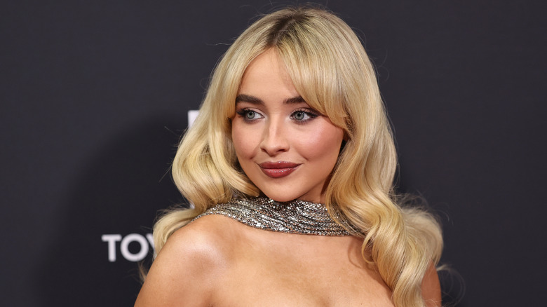 Sabrina Carpenter smiling at a red carpet event