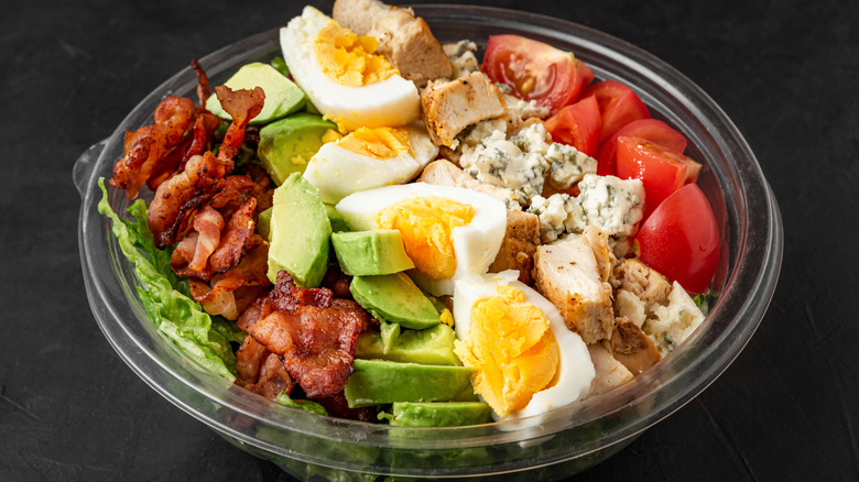 Cobb salad in plastic bowl