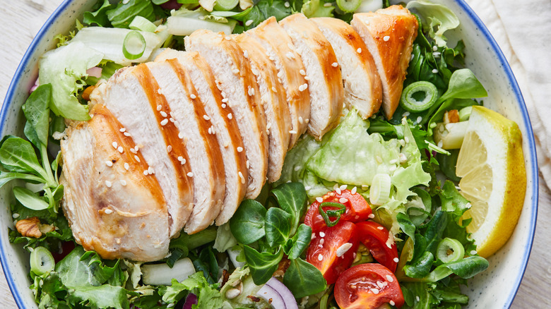 Bowl of salad with chicken breast