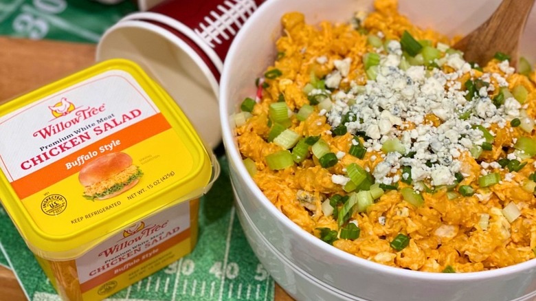 Willow Tree Buffalo chicken salad container next to a bowl of the salad