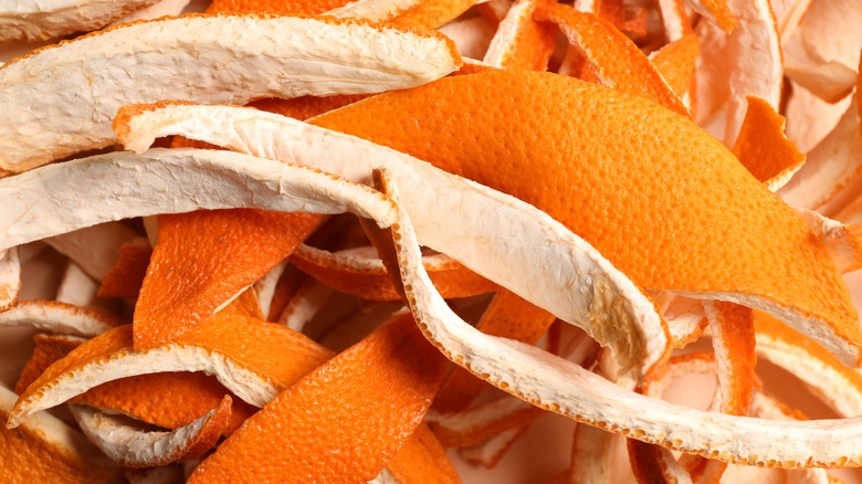 up close photo of a pile of orange peels.