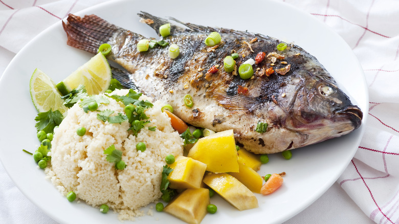 Grilled tilapia with mango, peas and rice