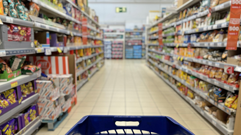 grocery store aisle with cart customer POV