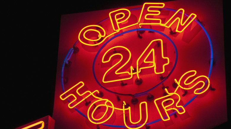 Neon sign the reads Open 24 Hours