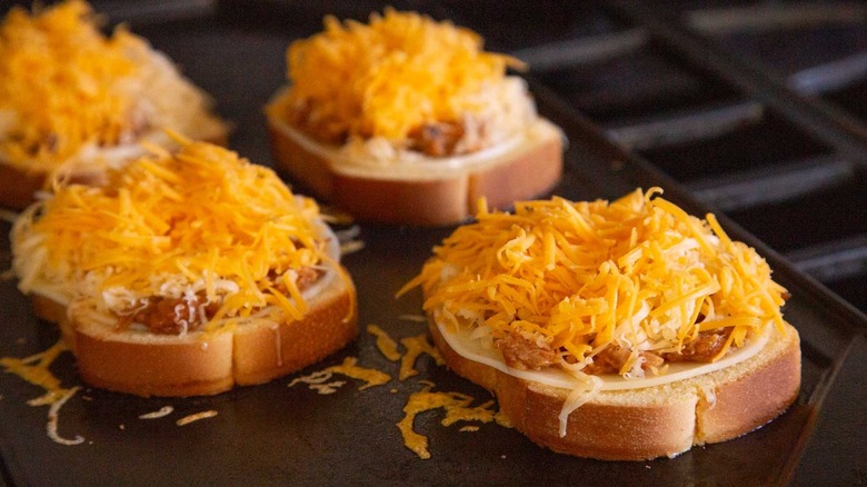 bread topped with shredded cheese