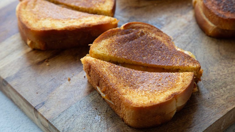 pulled pork grilled cheese sliced in half