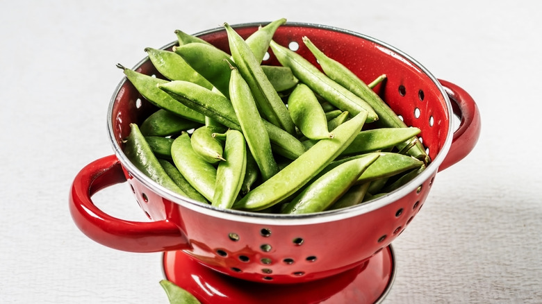 snap peas in colander