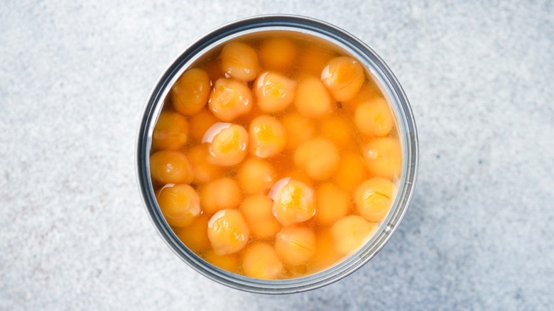 An aerial view of chickpeas in an open can