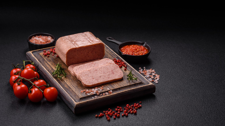 Sliced Spam on a wooden board