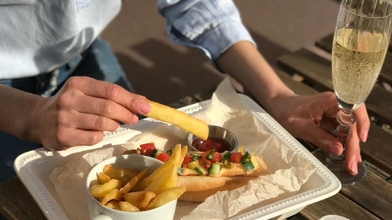 French fries and champagne outside