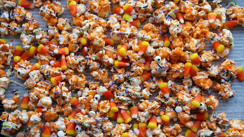 orange popcorn with sprinkles and candy corn