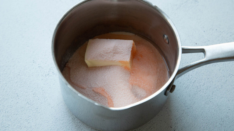 orange gelatin, sugar, and butter in a saucepan