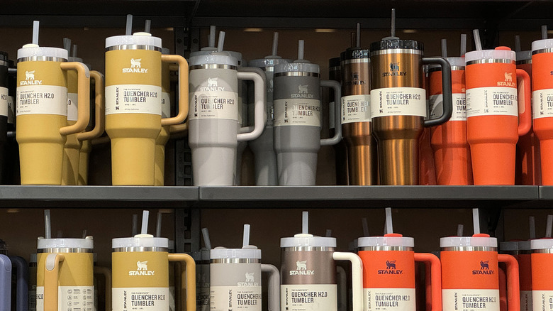 Various Stanley branded drink containers are shown on a display in a store