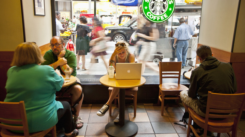 Customers sitting inside a Starbucks café