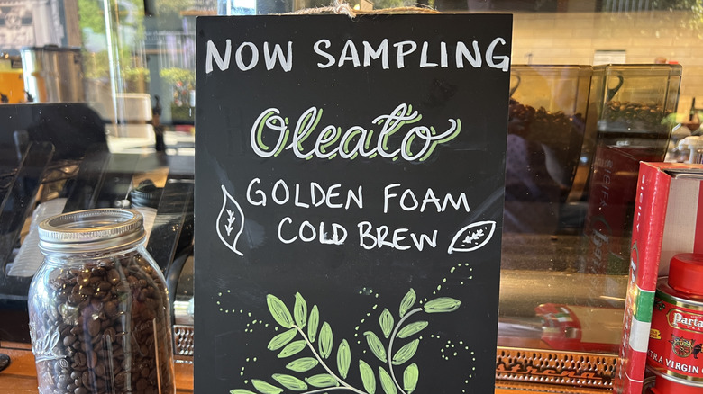 Image of sign that reads, "now sampling Oleato Golden Foam Cold Brew"