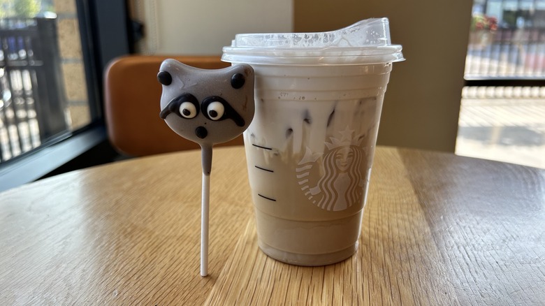 Raccoon cake pop and Starbucks iced drink