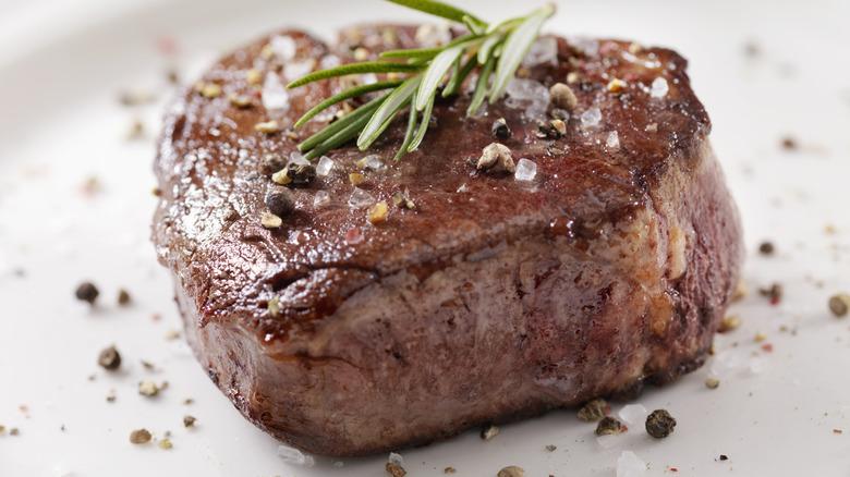 filet mignon steak with butter and herbs