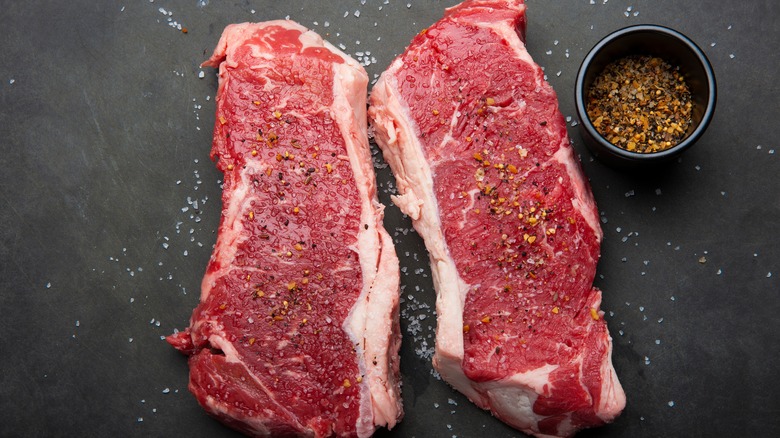 raw strip steaks