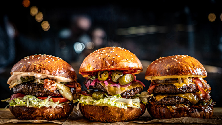 A lineup of three restaurant-quality burgers