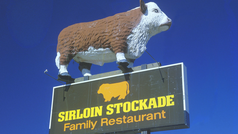 Sirloin Stockade sign with cow on top