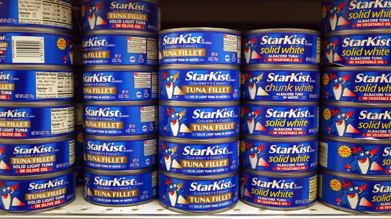 Stacks of canned tuna in grocery store